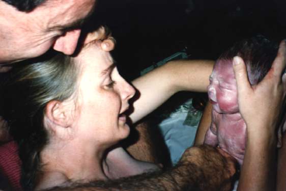 Parents greeting baby